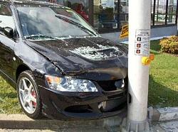 Youth Crashes New EVO thru Dealer Showroom!-34650255.jpg