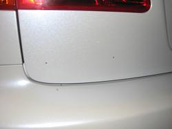 Which Emblem has the Holes behind it?-img_0055.jpg