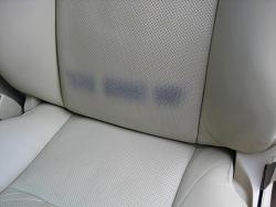 please help, front seat stained by my belt. picture attached-img_4397.jpg