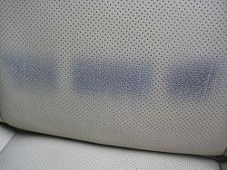 please help, front seat stained by my belt. picture attached-img_4398.jpg