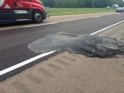 Oops, never a good site to see, but Lexus Road Side Stepped Up-pothole.jpg