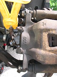 Rear caliper replacement-front-caliper-close-up-bumper-view.png