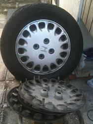 Stock Set of 4 Honda Steel Rims, Tires and Wheel Covers - 0-hub-caps.jpg